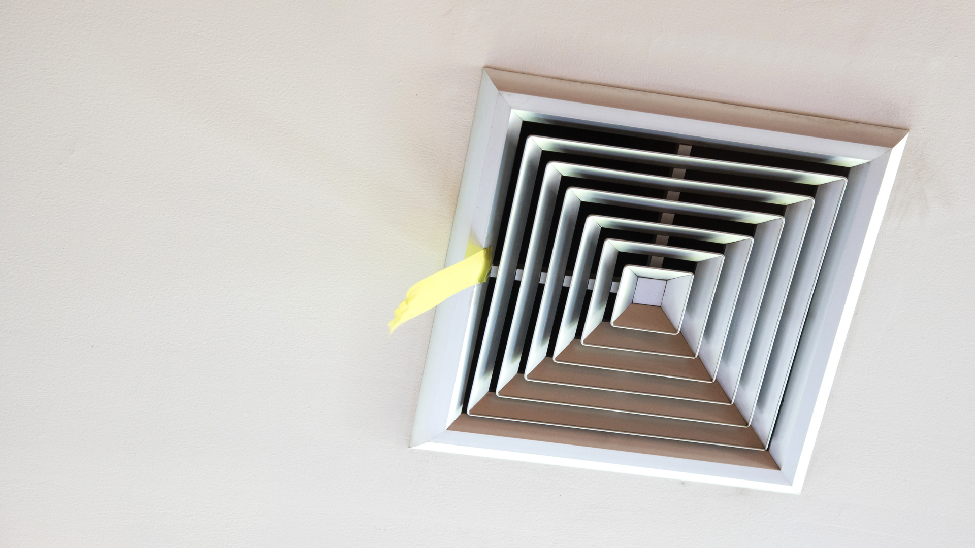 Ducted air conditioning vent installed in a ceiling for whole-home climate control.