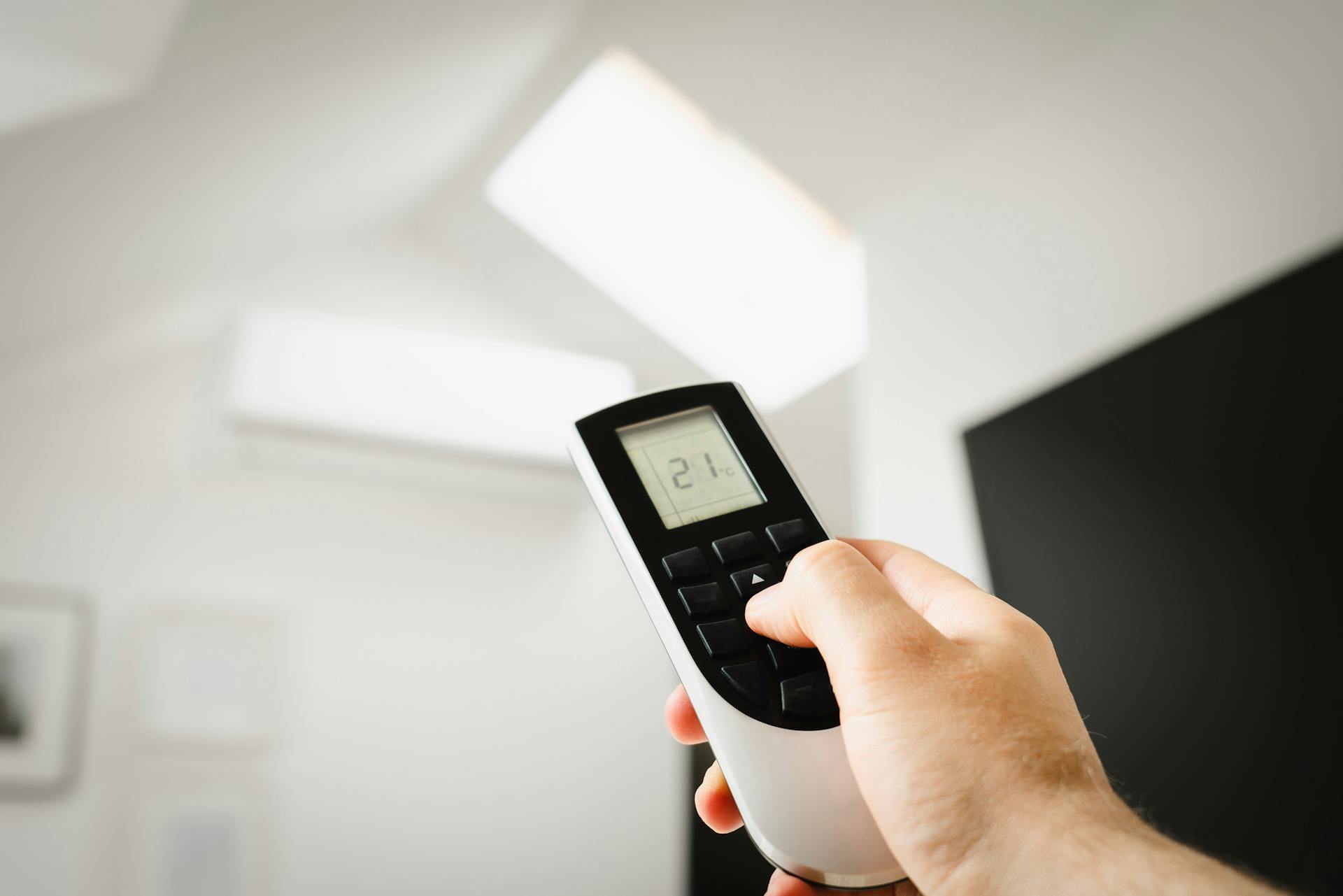 This is an image of a remote controlling the temperature of an air conditioning unit being serviced by GT HVAC in Melbourne.